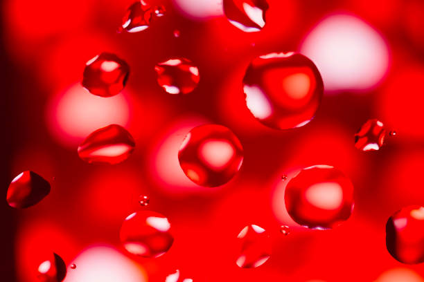 istock Abstract Background with Oil Drops on Red 679738300