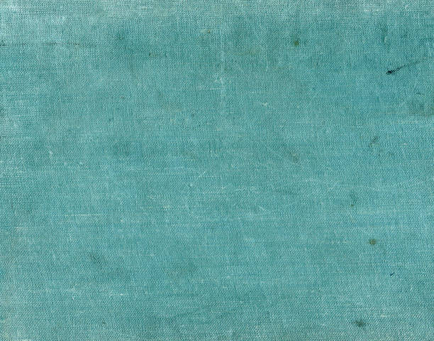 istock Cyan color textile surfacr with spots and scratches 679740304
