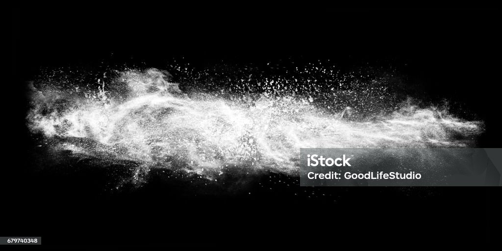 Exploding white powder Abstract exploding white powder isolated on black background. Snow Stock Photo