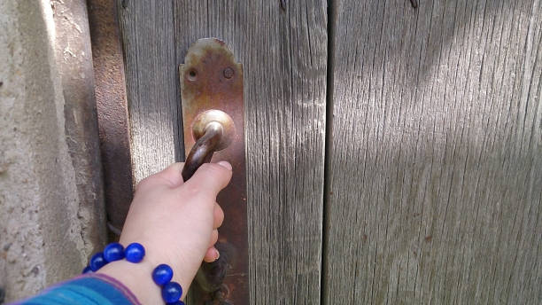 istock The hand holds the door handle. 679747660