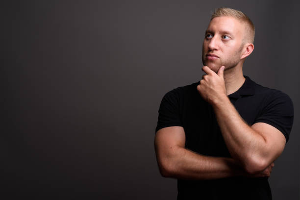 istock Studio shot of muscular man against gray background 679754732