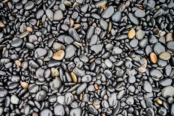 istock Black stones at Reynisfjara beach in Iceland 679757776