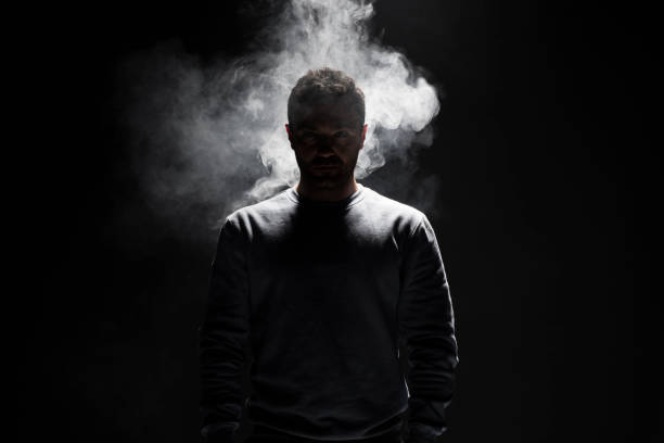 istock Man and Smoke fragments on a black background 679757876