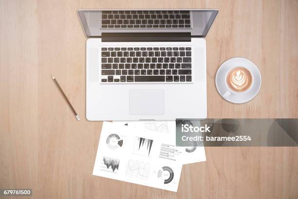 Businesss Desk Of Office Supplies And Gadgets Computer Telephone Pen Book Cactus On Empty Wooden Table Background Top View From Above Stock Photo - Download Image Now