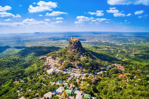 Aerial view of Mount Popa and the sacred Popa Taungkalat monastery, an important pilgrimage site and the favoured home of 37 Nats (aminist spirit entities), near Bagan, Myanmar.
