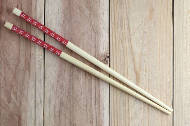 istock Chopsticks spoon on wood floor. 679764728