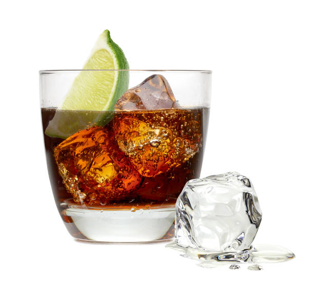 istock Cuba libre rum cocktail with ice cubes isolated on white background 679766952