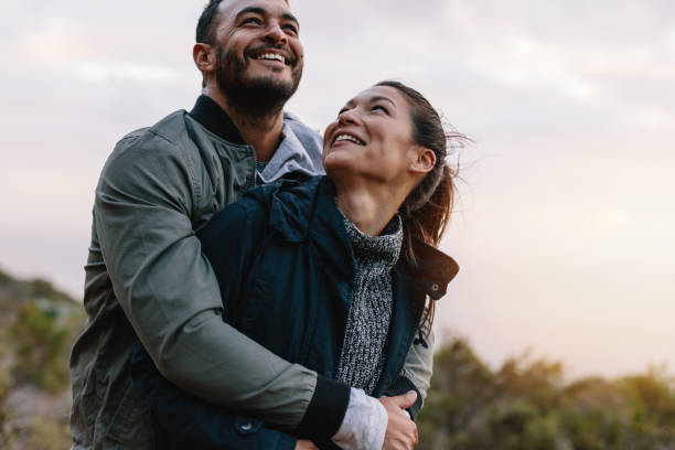 istock Romantic young couple embracing in nature 679775630
