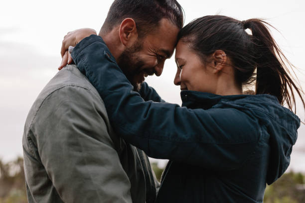 istock Romantic young couple standing together outdoor 679775698