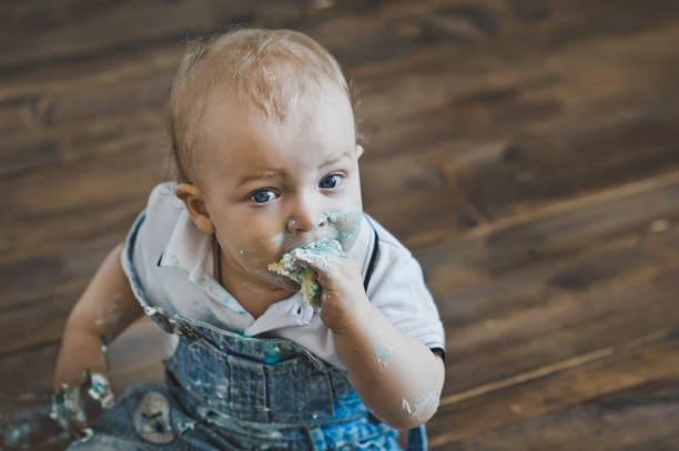 istock Child peremazalsya cake and sweets 5594. 679776470