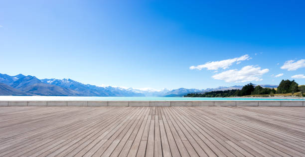 istock wooden floor with blue sea in blue sky 679777024