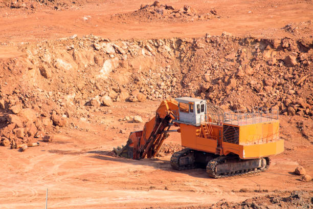 istock Part of a coal mine pit with big mining Excavator 679777064