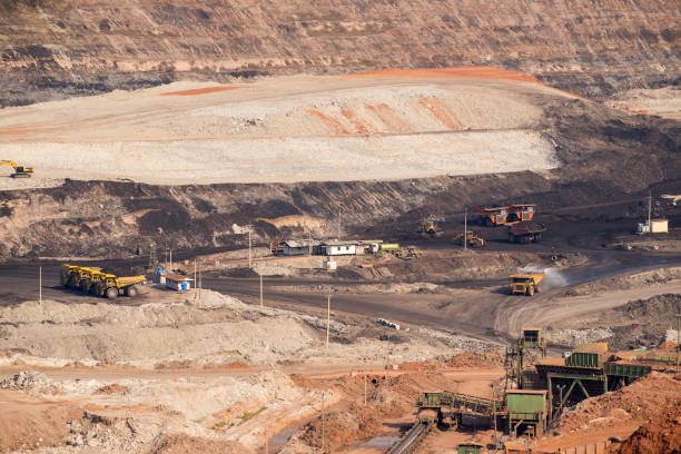istock Part of a coal mine pit with big mining truck working 679779390