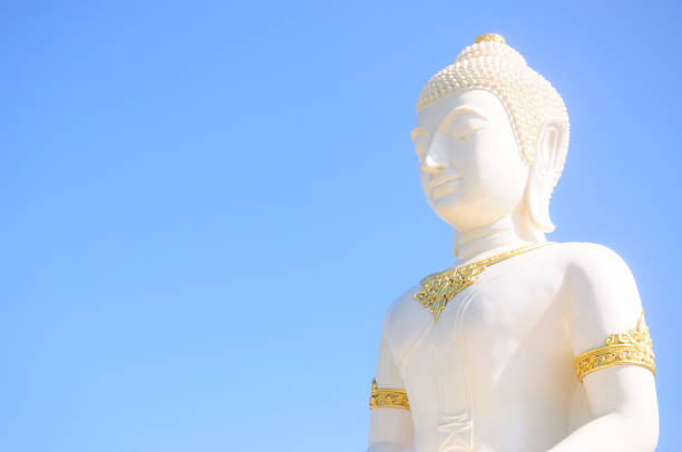 istock Beautiful white buddha and blue sky 679779926