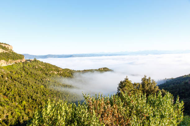 istock Clouds in the mountains lit by the sun. The view from the top. 679782692