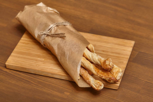 istock Baking sweet long cookies on wooden board 679784936