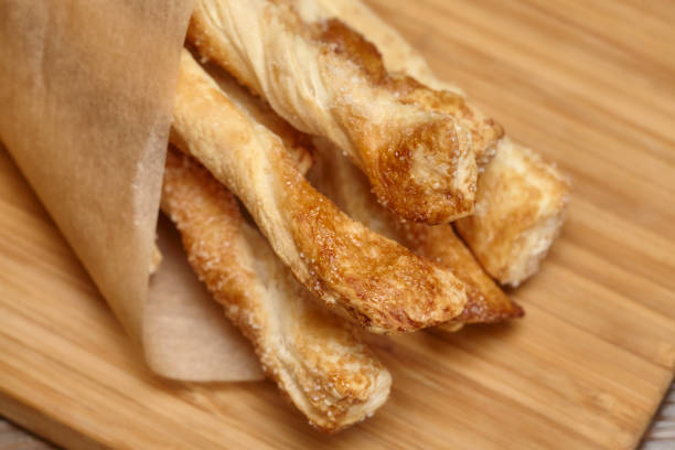 istock Baking sweet long cookies on wooden board 679784938