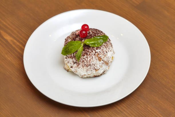 istock Round pastry ball, cake covered with white cream 679784964