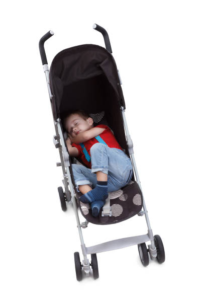 istock Child in a baby carriage on a white background 679785228