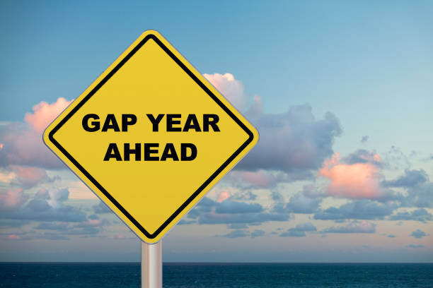 Diamond-shaped crossing sign with yellow background and black border with a short phrase saying “Gap year Ahead” in the middle.