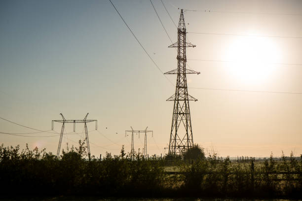 istock electricity line in sunny meadow 679793988
