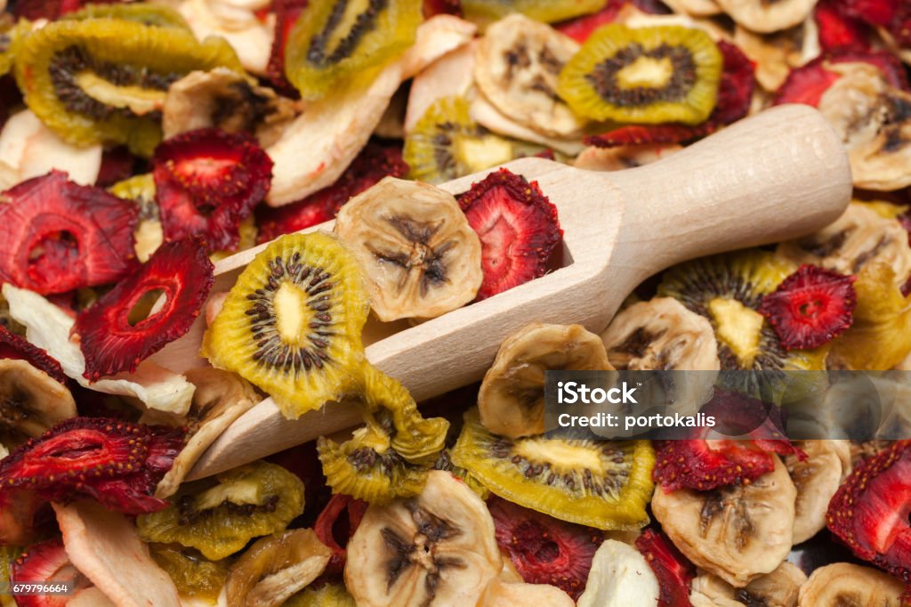 Various dried fruits Different varieties mix of dried fruits with wooden scoop Banana Stock Photo