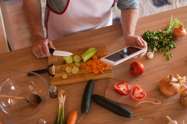 istock Man finding recipes and making food 679797214