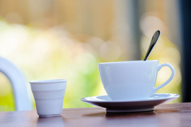 istock A spoon in cup of coffee on the table, blurry background 679797986