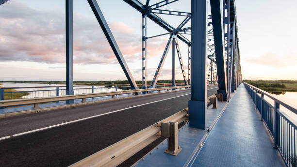 istock railway bridge with metal rails near river 679800374