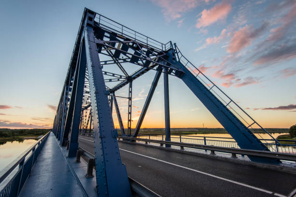 istock railway bridge with metal rails near river 679800442