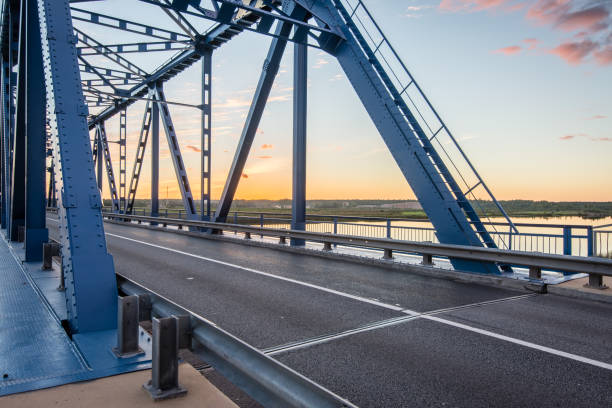 istock railway bridge with metal rails near river 679800610