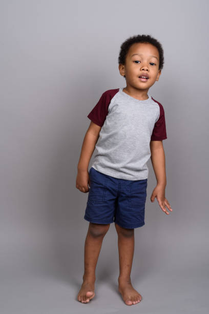 istock Studio shot of young African boy against gray background 679801590