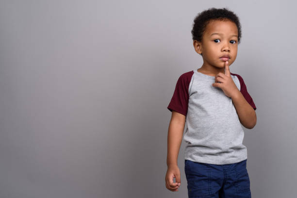 istock Studio shot of young African boy against gray background 679801666