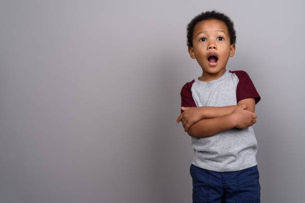 istock Studio shot of young African boy against gray background 679803776