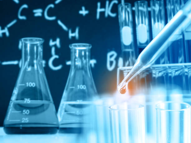 istock Dropping chemical liquid to test tubes 679815624