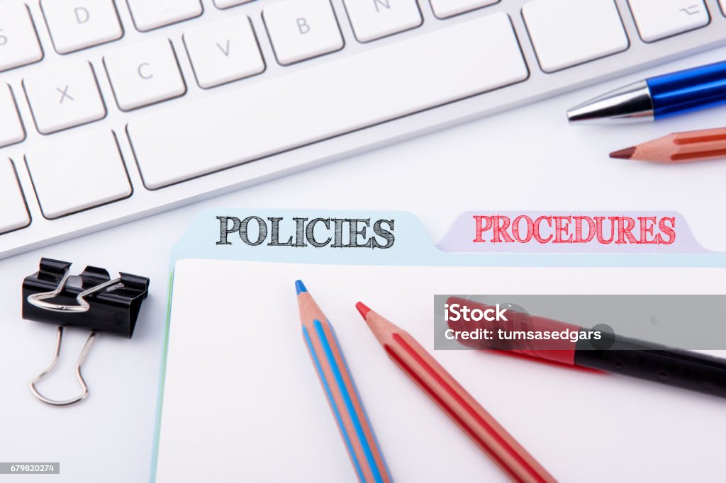 Policies and Procedures. Folder Register on a white Office Table Strategy Stock Photo
