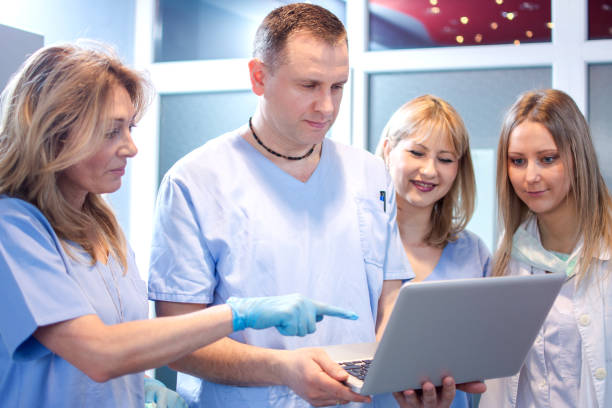 istock Dentist team working together in dental office. 679829472