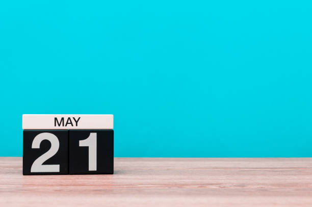 istock May 21st. Day 21 of month, calendar on turquoise background. Spring time, empty space for text 679839556