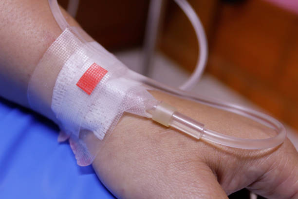 istock saline solution in a patients hand at hospital 679853424