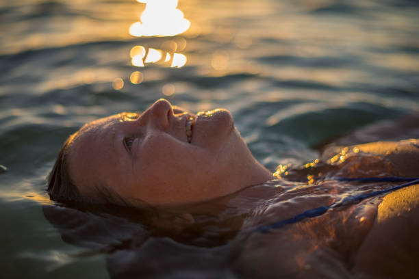 istock Senior lady relaxing in ocean 679853800