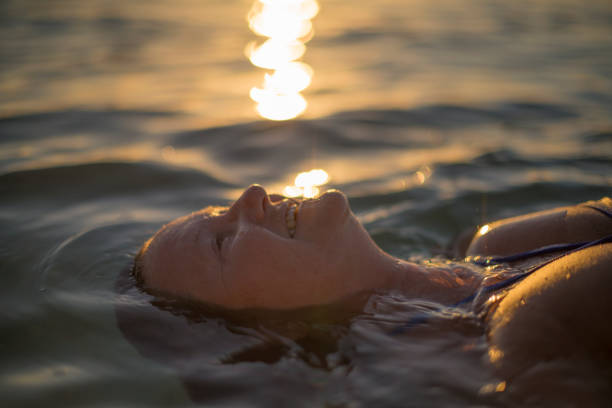 istock Senior lady relaxing in ocean 679853830