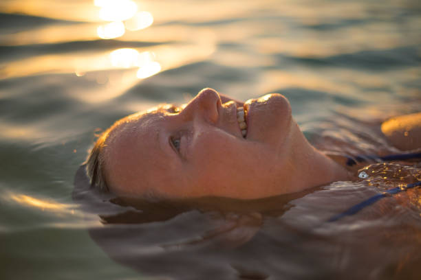 istock Senior lady relaxing in ocean 679853904