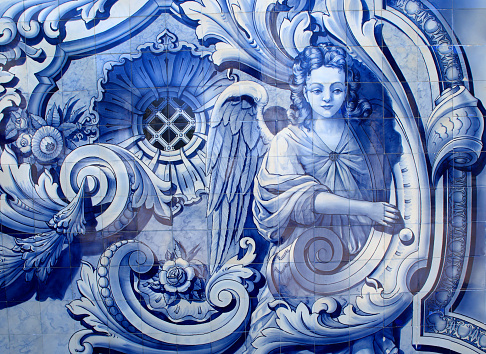 Portugal, Douro Region, Lamego. Typical historical blue and white ceramic 'azulejo' tiles on exterior wall, depicting an angel. (historical images - no copyright issues)