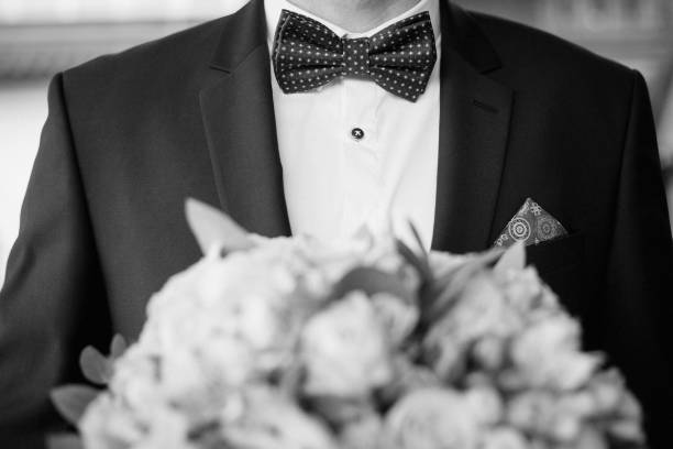 istock Grooms morning preparation. Handsome groom getting dressed and preparing for the wedding 679867642