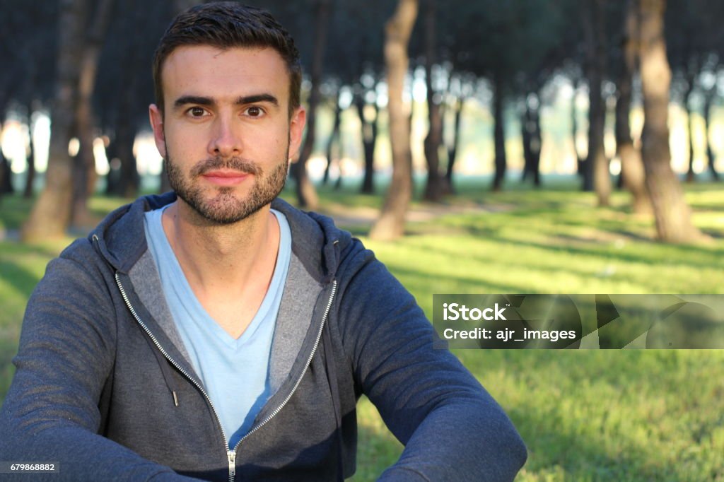 Handsome man relaxing in the park Handsome man relaxing in the park. 30-34 Years Stock Photo