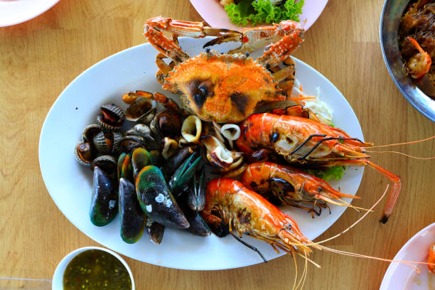 istock seafood grill close up shrimp squid and 679869154