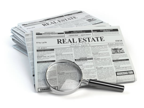 real estate classifieds ads newspaper  and magnifying glass - house rental house real estate real estate sign imagens e fotografias de stock