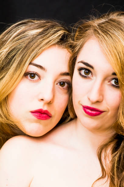 istock Two beautiful women Portrait over Black Background 679881982