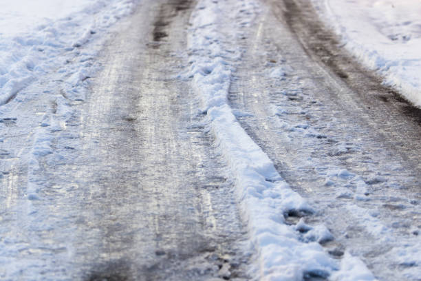 istock Snow with puddles on the road 679885058