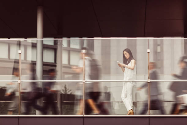 istock Businesswoman texting on phone 679891136